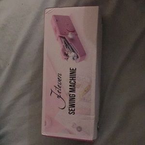 Hand held sewing machine